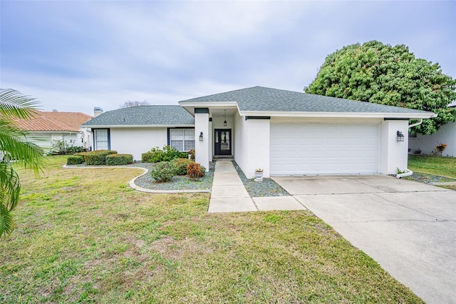 view of front of home with a garage and a front lawn