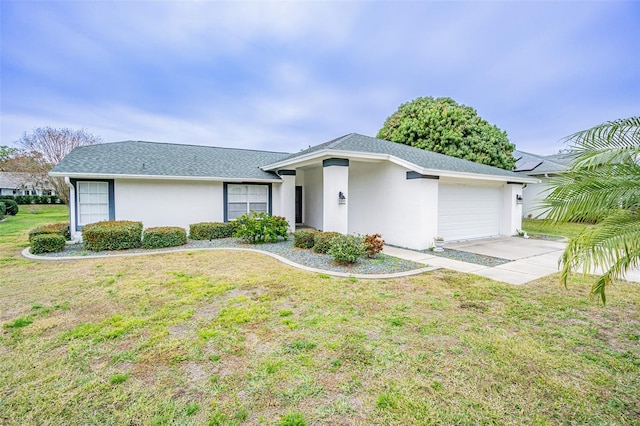 ranch-style house featuring a garage and a front lawn