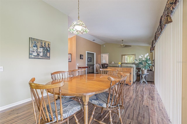 dining area featuring dark hardwood / wood-style floors, ceiling fan, and lofted ceiling