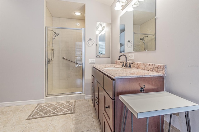 bathroom with tile patterned floors, vanity, and a shower with shower door