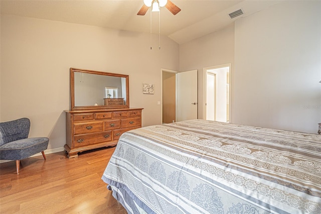 bedroom with high vaulted ceiling, light hardwood / wood-style flooring, and ceiling fan