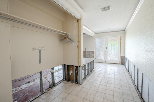 washroom with french doors and ornamental molding