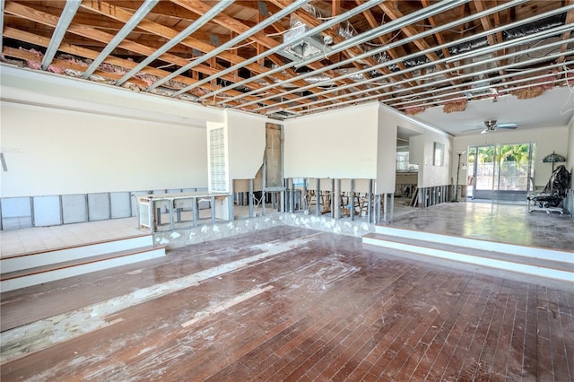 interior space with ceiling fan