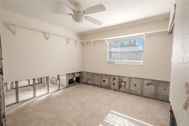 unfurnished room featuring ceiling fan