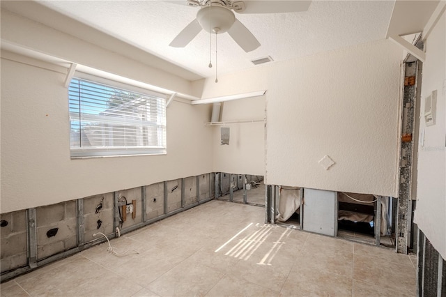 interior space featuring ceiling fan