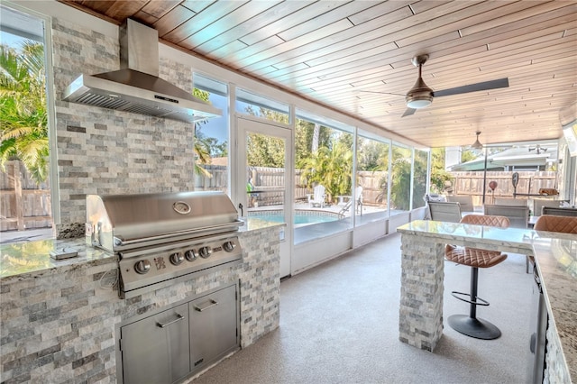 sunroom featuring wooden ceiling