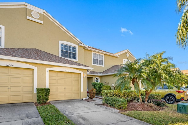 multi unit property featuring a garage