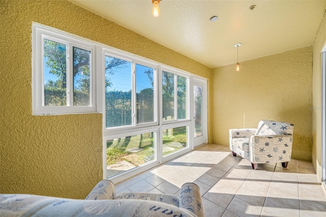 sunroom featuring lofted ceiling