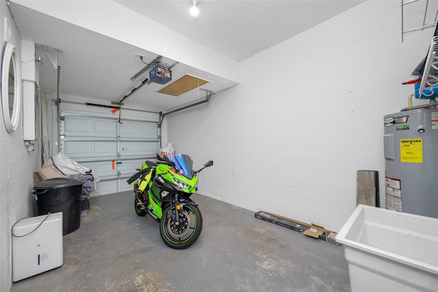 garage featuring a garage door opener and electric water heater