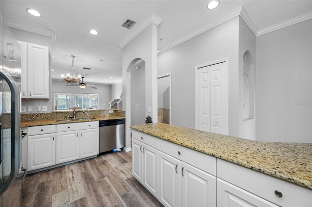 kitchen featuring light stone countertops, ceiling fan, white cabinets, stainless steel dishwasher, and sink