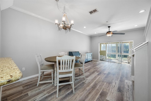 dining area featuring ceiling fan with notable chandelier, ornamental molding, and hardwood / wood-style flooring