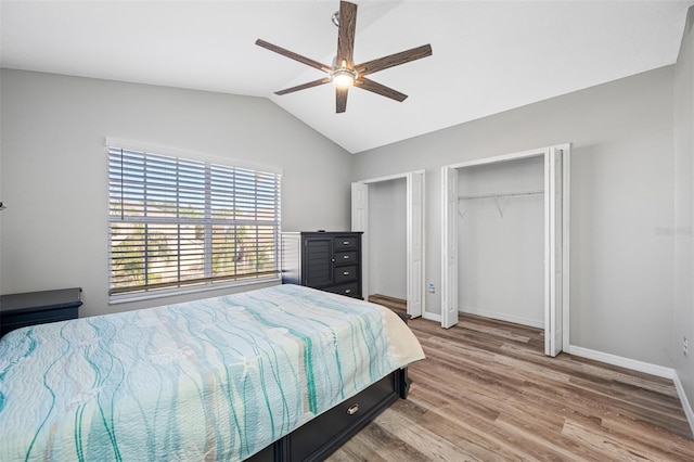 bedroom featuring ceiling fan, vaulted ceiling, and light hardwood / wood-style flooring