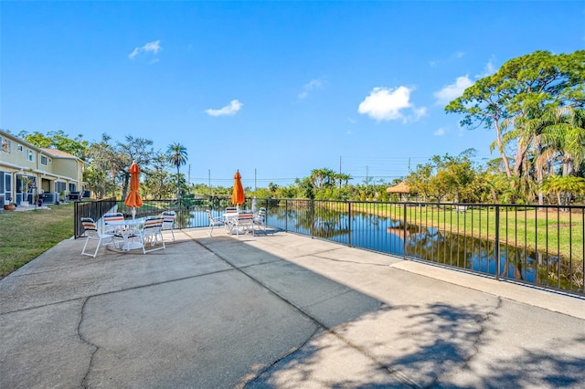 view of patio featuring a water view