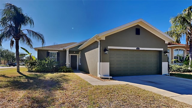 ranch-style house with a front yard and a garage