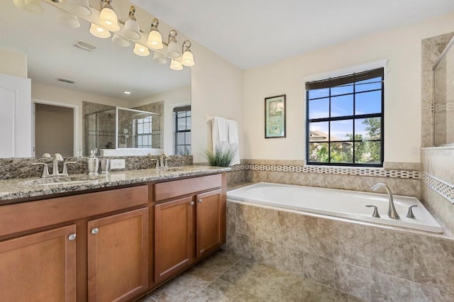 bathroom featuring plus walk in shower and vanity