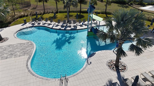 view of swimming pool with a patio area