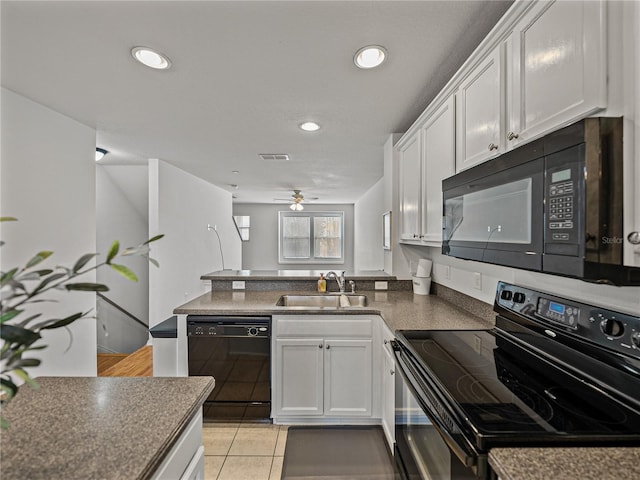 kitchen featuring sink, white cabinetry, ceiling fan, and black appliances