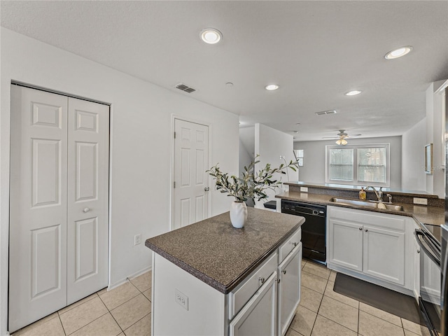 kitchen featuring black appliances, white cabinets, sink, ceiling fan, and a kitchen island