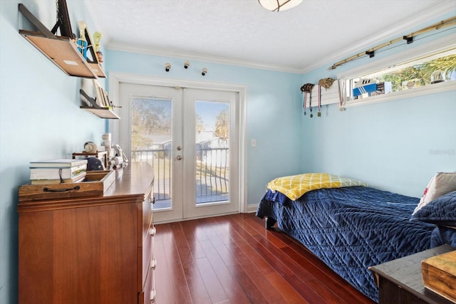 bedroom with dark hardwood / wood-style floors, multiple windows, access to outside, and french doors