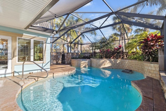 view of swimming pool with a patio and glass enclosure