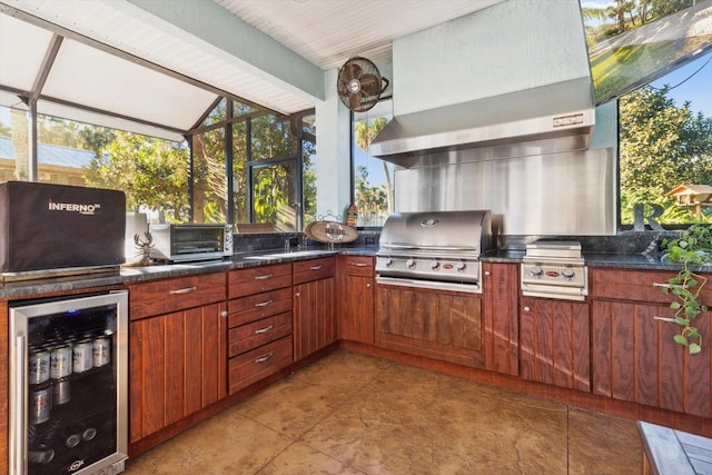 view of patio featuring a grill, area for grilling, and beverage cooler