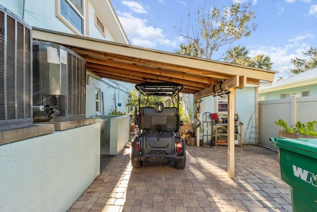 view of patio featuring a carport and central air condition unit