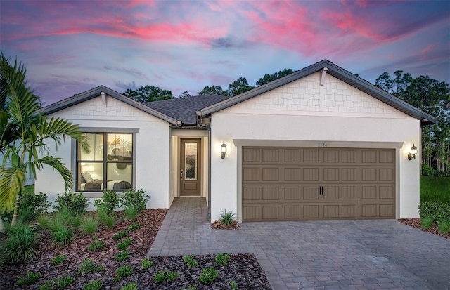 view of front of property with a garage