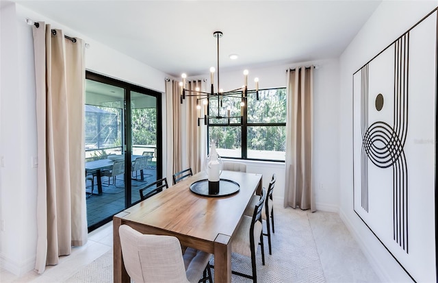 tiled dining space with a chandelier