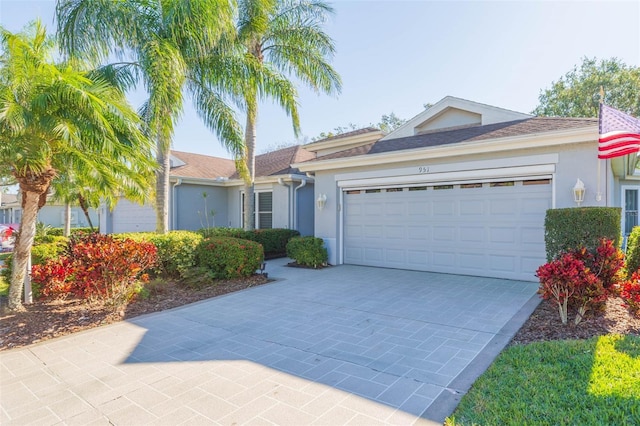 single story home with a garage