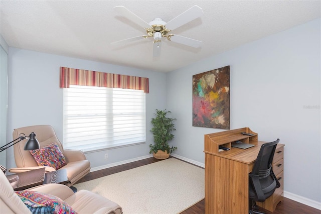 office area with dark hardwood / wood-style floors, a textured ceiling, and ceiling fan