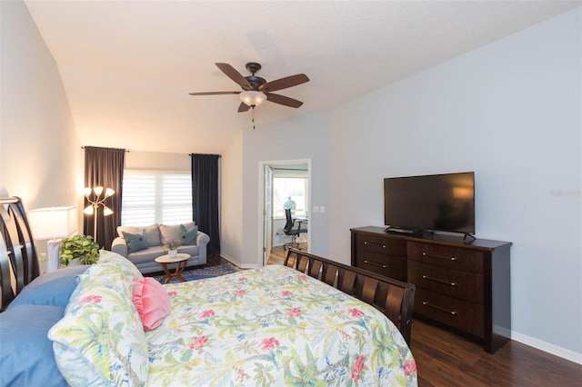 bedroom with lofted ceiling, dark wood-type flooring, and ceiling fan