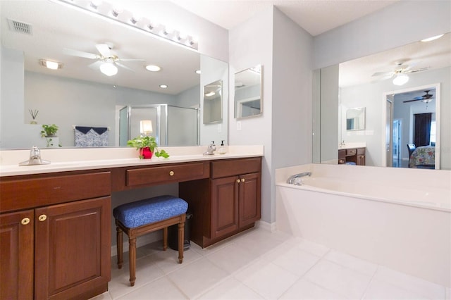 bathroom featuring tile patterned flooring, vanity, and plus walk in shower