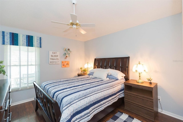 bedroom with dark wood-type flooring and ceiling fan