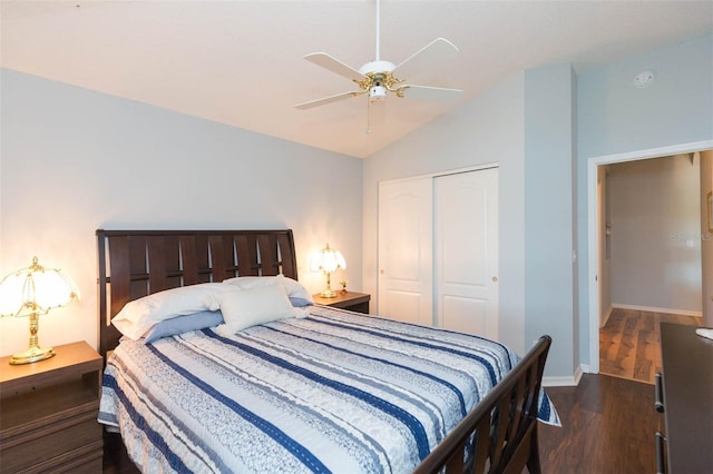 bedroom featuring dark hardwood / wood-style flooring, lofted ceiling, a closet, and ceiling fan