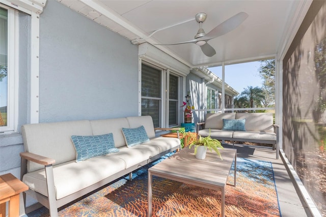 sunroom / solarium featuring ceiling fan