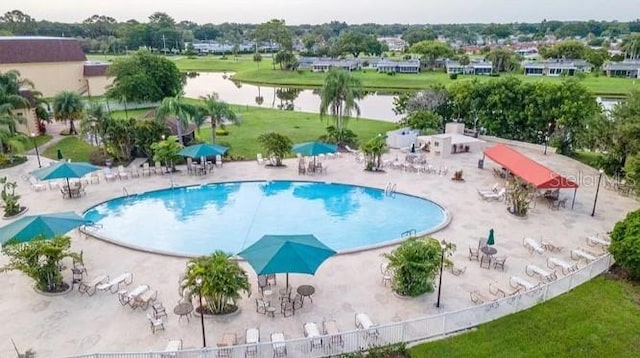 view of pool featuring a water view