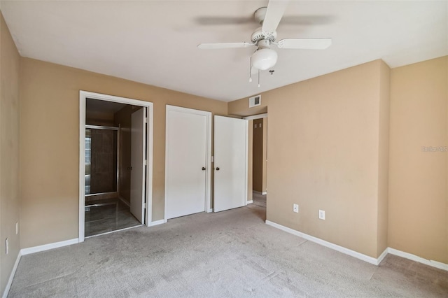 unfurnished bedroom featuring visible vents, baseboards, a ceiling fan, and carpet flooring