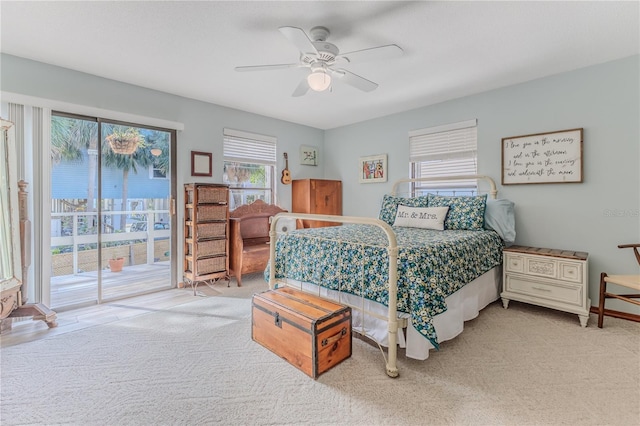 bedroom with carpet, access to outside, and ceiling fan