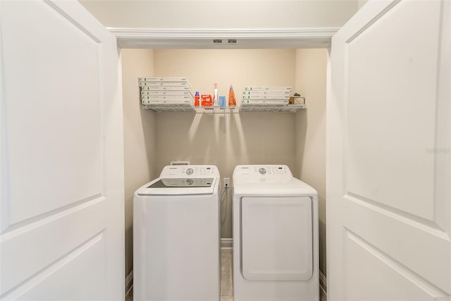 washroom with independent washer and dryer