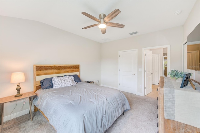 carpeted bedroom featuring vaulted ceiling and ceiling fan