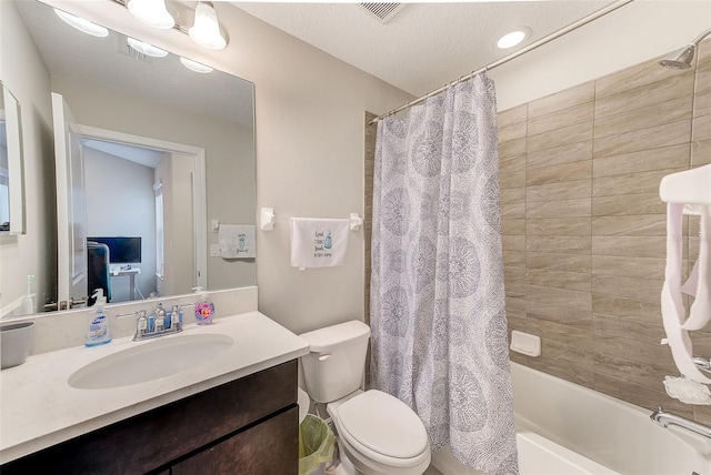 full bathroom with vanity, toilet, a textured ceiling, and shower / bathtub combination with curtain