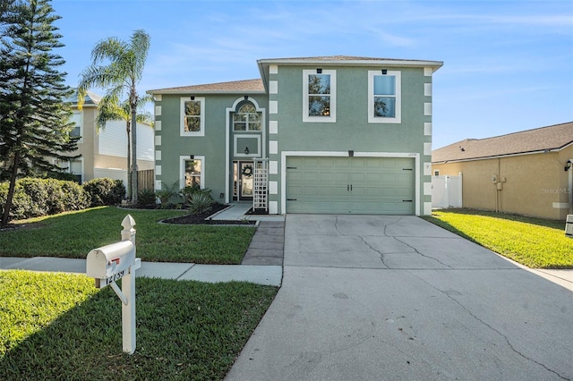 view of front of property featuring a garage and a front yard