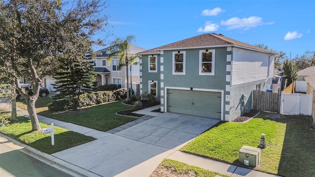 view of front of property featuring a front yard and a garage