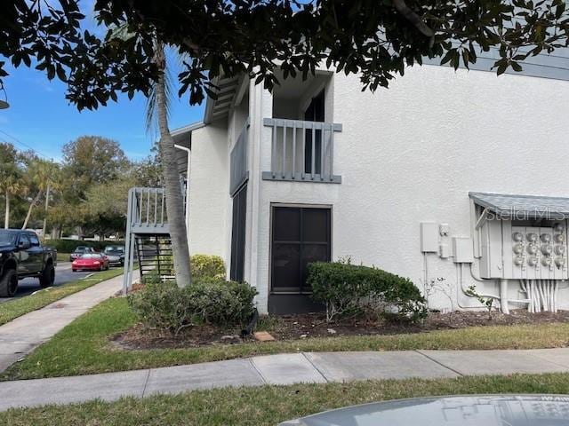 view of property exterior with a balcony