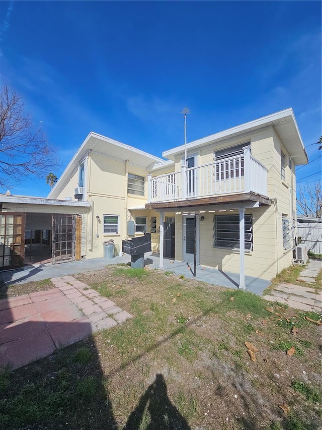 rear view of property featuring a patio