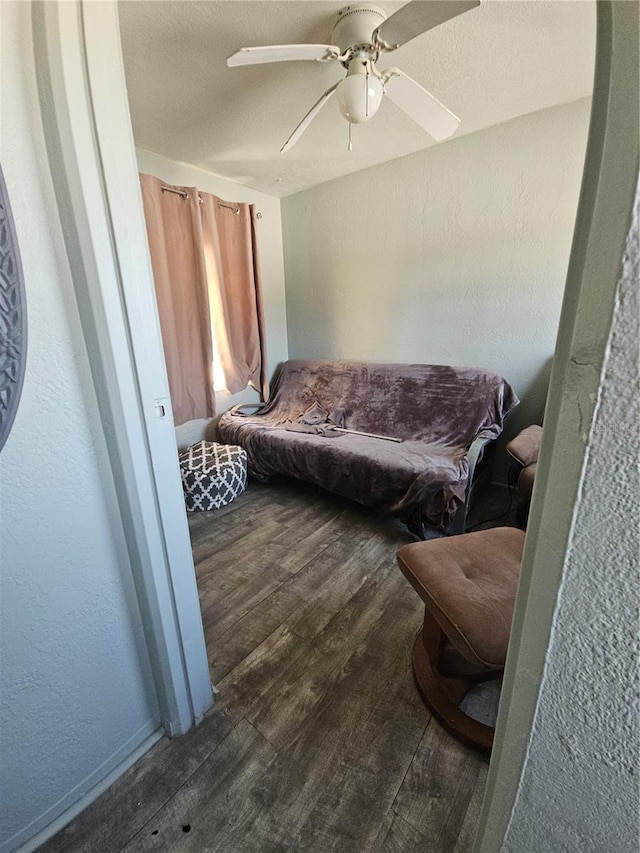 interior space featuring ceiling fan and dark hardwood / wood-style flooring