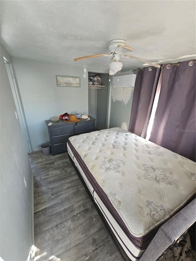 bedroom with ceiling fan and dark hardwood / wood-style floors