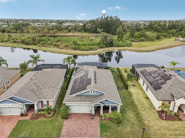 birds eye view of property with a water view