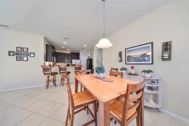 dining area featuring light tile patterned floors