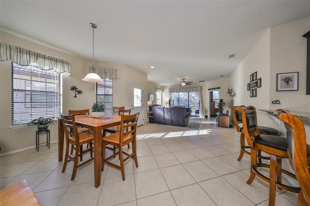 dining room with ceiling fan and light tile patterned floors